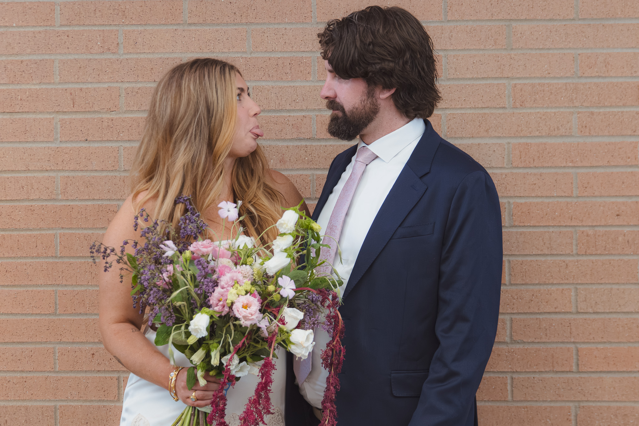 Denver elopement photographer — couple sharing an intimate moment outside the courthouse