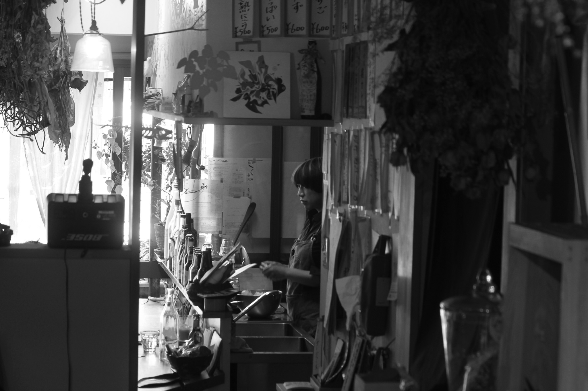 Atmospheric interior of a Japanese tea house with shelves of herbs and bottles